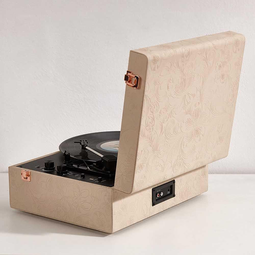 A side view of the Arkrocket Coryphaeus Bluetooth Turntable Deluxe Edition Record Player (Flora Engraved) shows its textured floral exterior and the open lid