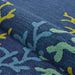 A side view of the Couristan Covington Indoor/Outdoor Rug - Sea Water/Ocean-Aqua shows its textured, looped pile with flowing coral patterns