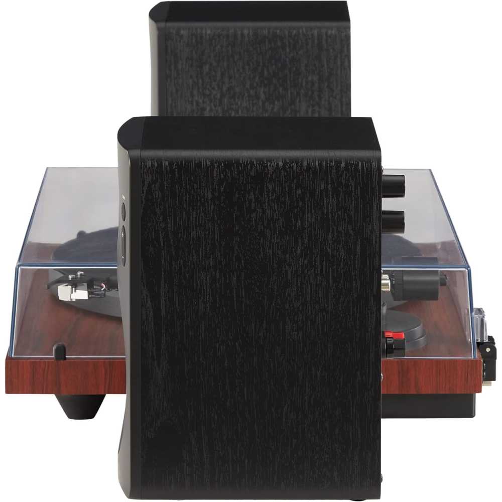 A side view of the Crosley KT6101 K-Series Turntable System - Mahogany shows the speakers and turntable with a clear dust cover