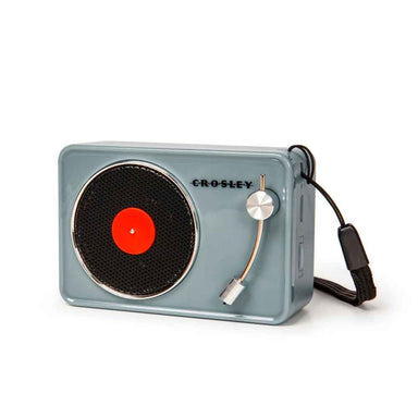 A side view of the Crosley Mini Turntable Bluetooth Speaker - Tourmaline shows a USB charging port and a small button for controls