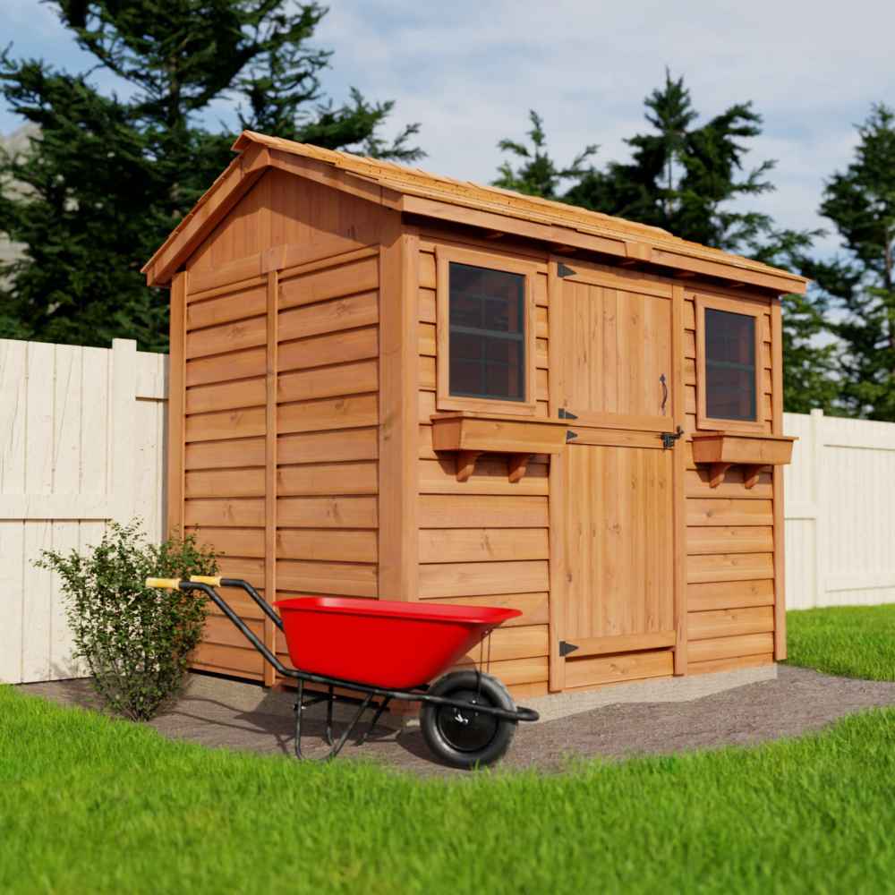 A side view of the Outdoor Living Today 9×6 Cabana Garden Shed features twin windows and cedar roof with flower boxes and a red wheelbarrow on a grassy yard
