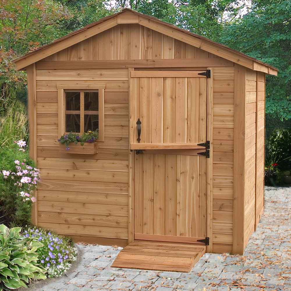 A small wooden shed with a pitched roof, a window box of flowers, and a ramp at the door, showcasing the Outdoor Living Today 8×8 Gardener Shed