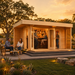 Asta 70 wooden garden room transformed into an upscale backyard bar, with friends socializing during golden hour in the Texas Hill Country.