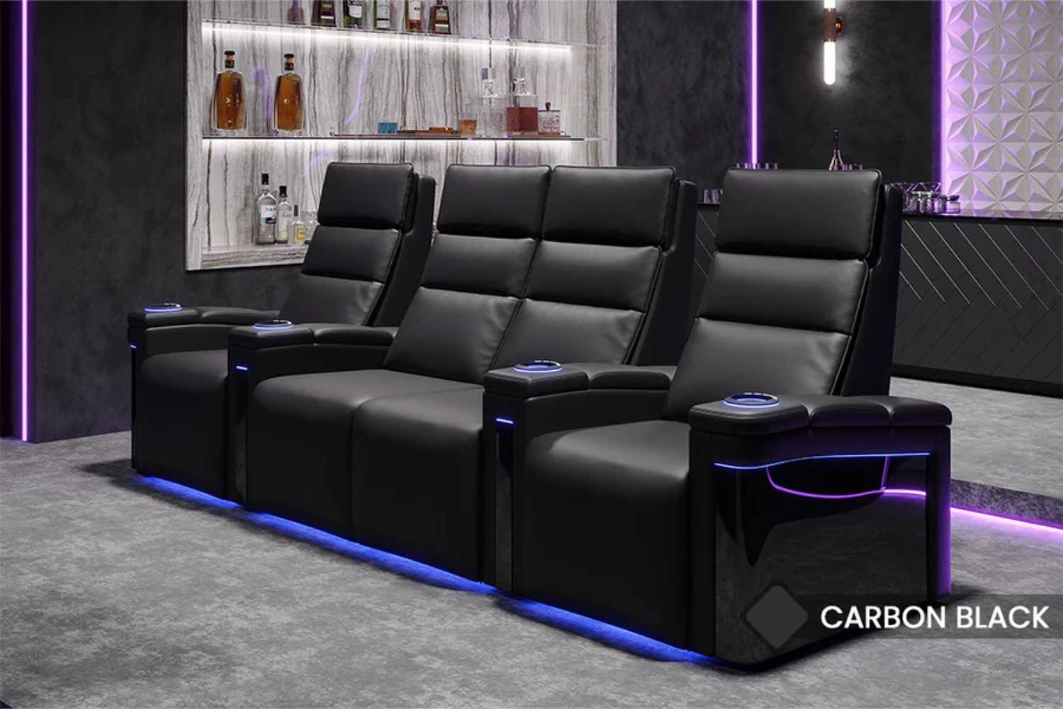 A stylish row of three recliners with illuminated cup holders enhances the cinematic experience with the Valencia Monza Pillow Top Carbon Fiber Home Theater Seating