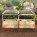 A sunny backyard features a see-through mesh-topped Outdoor Living Today 6×3 Raised Garden Bed brimming with vegetables and flowers