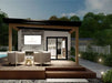 At dusk, Sawmill Structures The Tremblant Garden Suites glows warmly as its covered patio with wicker chairs and a fire pit