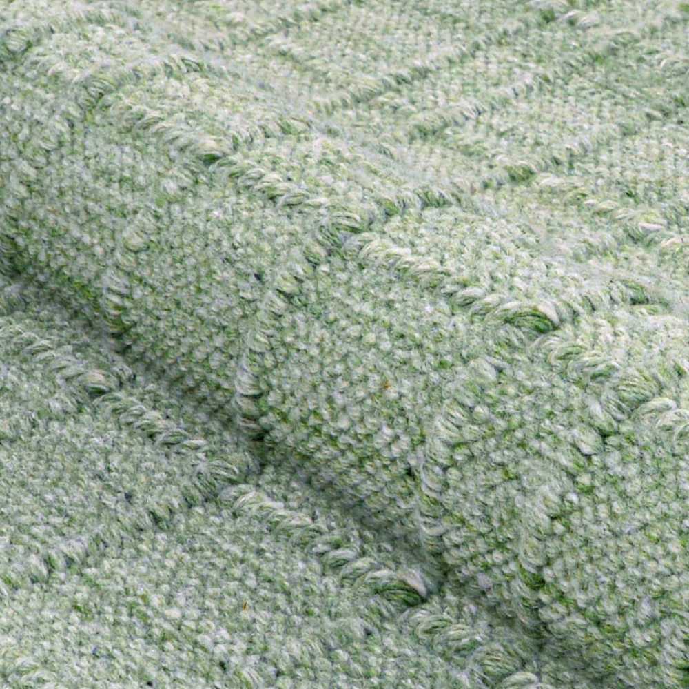 A tight fabric close-up displays the Couristan Ascot Indoor/Outdoor Rug - Windowpane/Celedon’s thick, looped weave and checkered texture in celedon green
