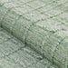 A tight fabric close-up displays the Couristan Ascot Indoor/Outdoor Rug - Windowpane/Celedon’s thick, looped weave and checkered texture in celedon green