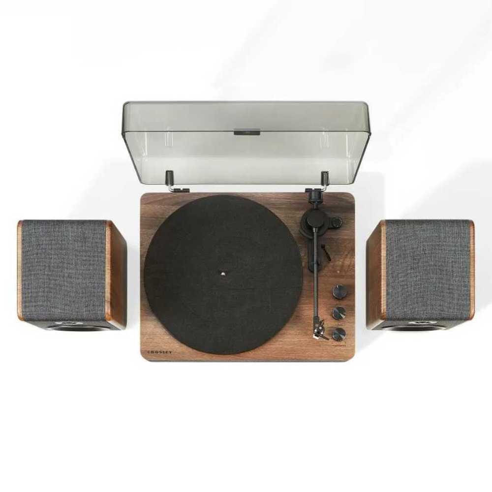 A top-down view captures the Crosley Nocturne Record Player With Speakers - Charcoal with the lid open and speakers symmetrically placed