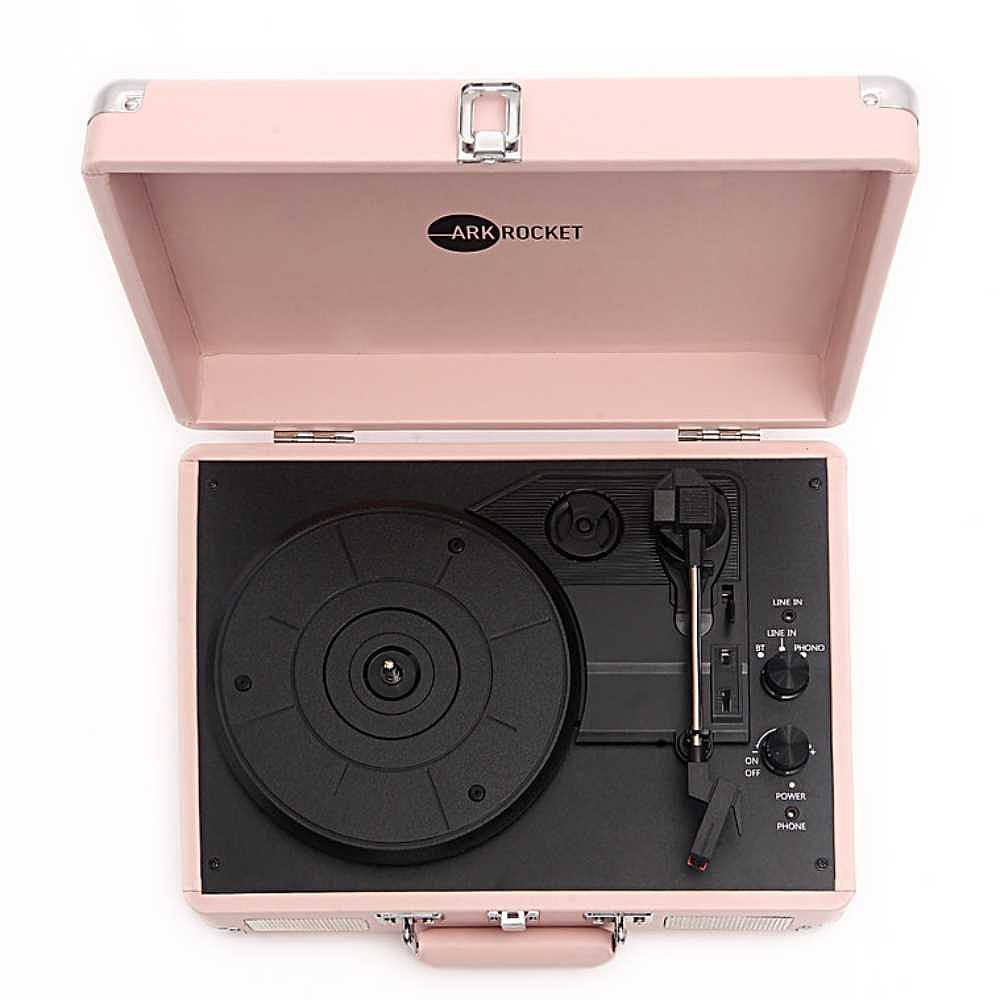 A top-down view of Arkrocket Curiosity Suitcase Bluetooth Turntable (Pale Pink) showing its turntable platter and tonearm with control knobs