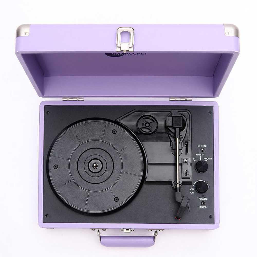 A top-down view of the Arkrocket Curiosity Suitcase Bluetooth Turntable (Lavender) highlights the turntable, controls, and needle inside the open lavender case