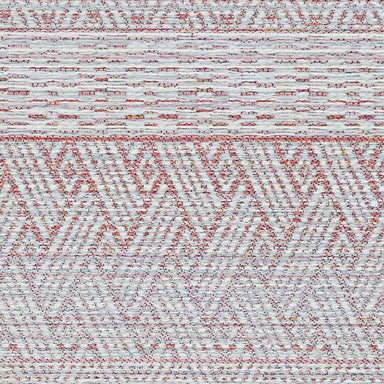 A top-down view of the Couristan Cape Indoor/Outdoor Rug - Gables/Hibiscus, highlighting its repeated zigzag and diamond motifs in soft pink and ivory