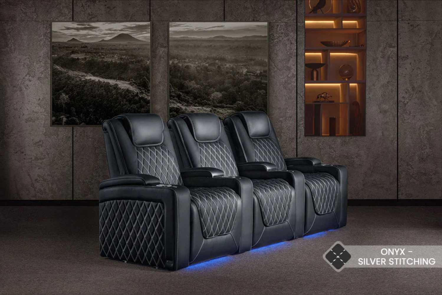 A trio of Valencia Oslo Ultimate Edition Home Theater Seating chairs showcases elegant silver stitching and glowing blue base lights