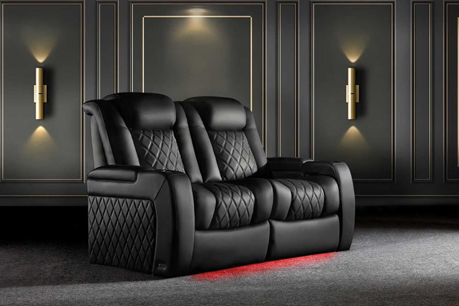 A two-seater onyx Valencia Tuscany XL Luxury Edition Home Theater Seating with striking under-seat LED lighting in a sophisticated home setting