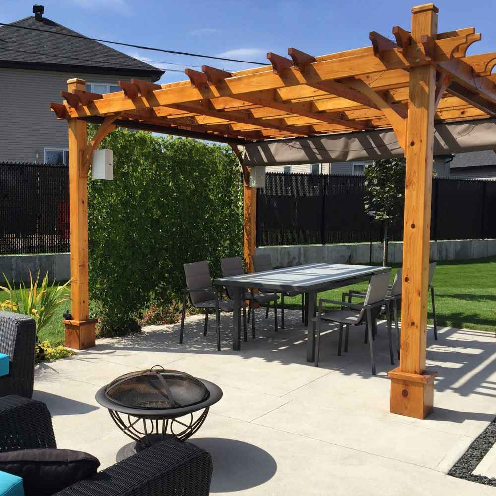 A welcoming backyard dining area covered by the Outdoor Living Today Western Red Cedar Pergola & Canopy for enjoyable outdoor meals