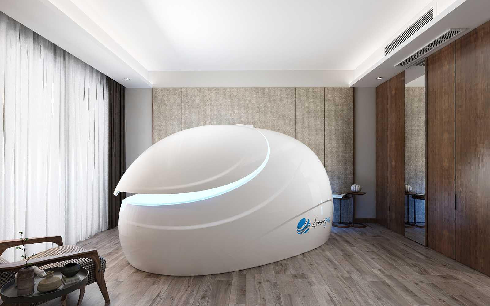 A white Dreampod Sport Float Pod with soft blue lighting inside is in a minimalistic room featuring wood floors and neutral decor