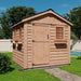 A wooden garden shed with a side row of large windows and a front door, sitting on green grass, featuring the Outdoor Living Today 8×8 Gardener Shed