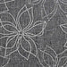 A zoomed-in section of the Couristan Charm Indoor/Outdoor Rug - Botanical/Ash clearly shows the intricate white floral design against a dark ash weave