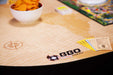 BBO Poker Tables Portable Poker Party Mat - World Traveler features a bowl of chips, play money, and a map-themed design