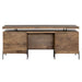 Back view of Crate & Barrel Raffael Carved Wood Executive Desk showing the smooth wood panels, modesty panel, and rear cabinet doors