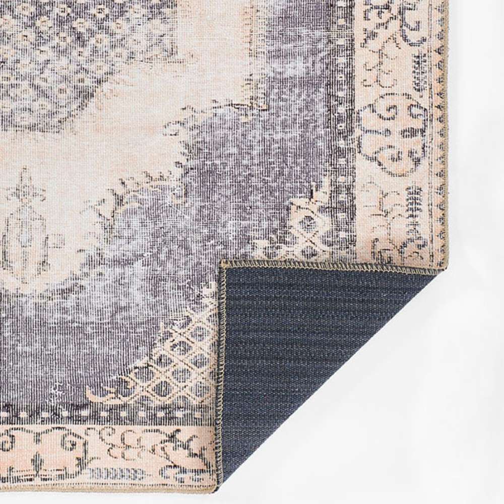 Back corner of Momeni Afshar Indoor Rug - AFS35 Denim is folded to reveal its durable backing