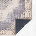 Back corner of Momeni Afshar Indoor Rug - AFS35 Denim is folded to reveal its durable backing