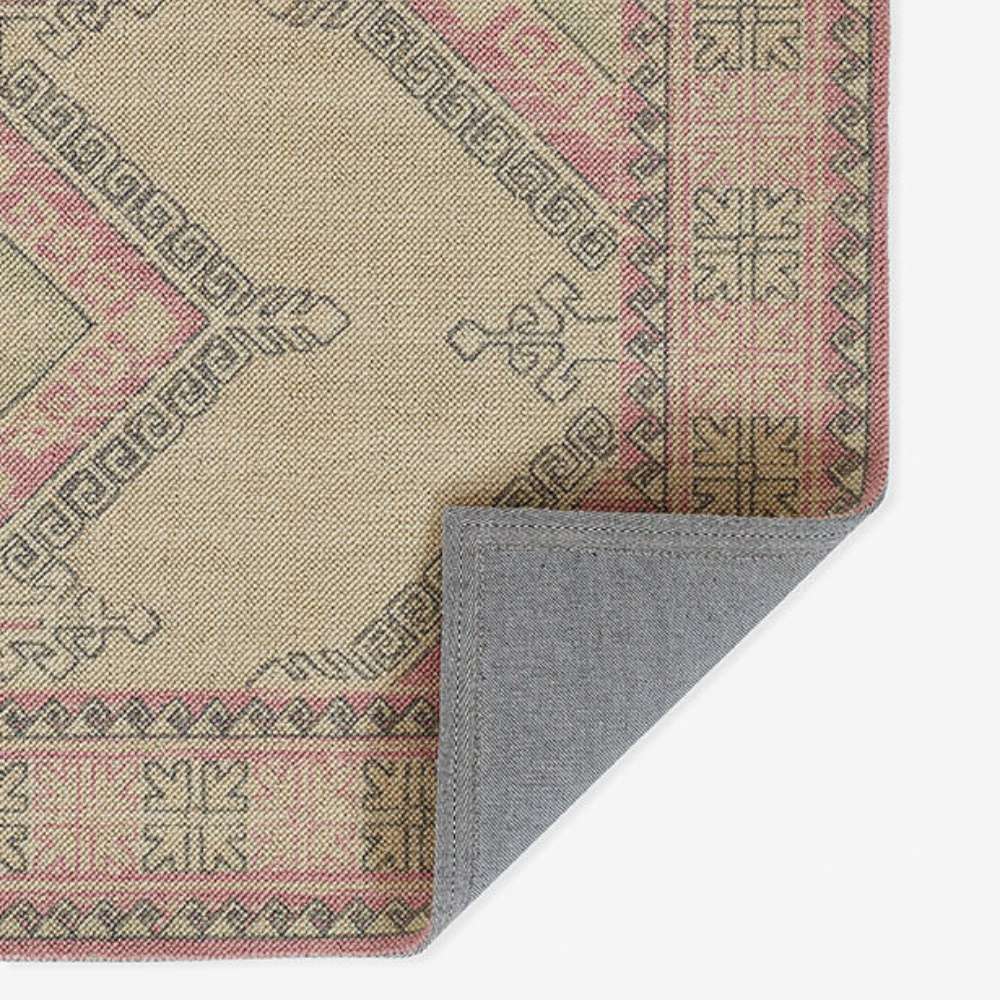 Back corner of Momeni Anatolia Indoor Rug - ANA-10 Pink lifted up revealing its sturdy backing
