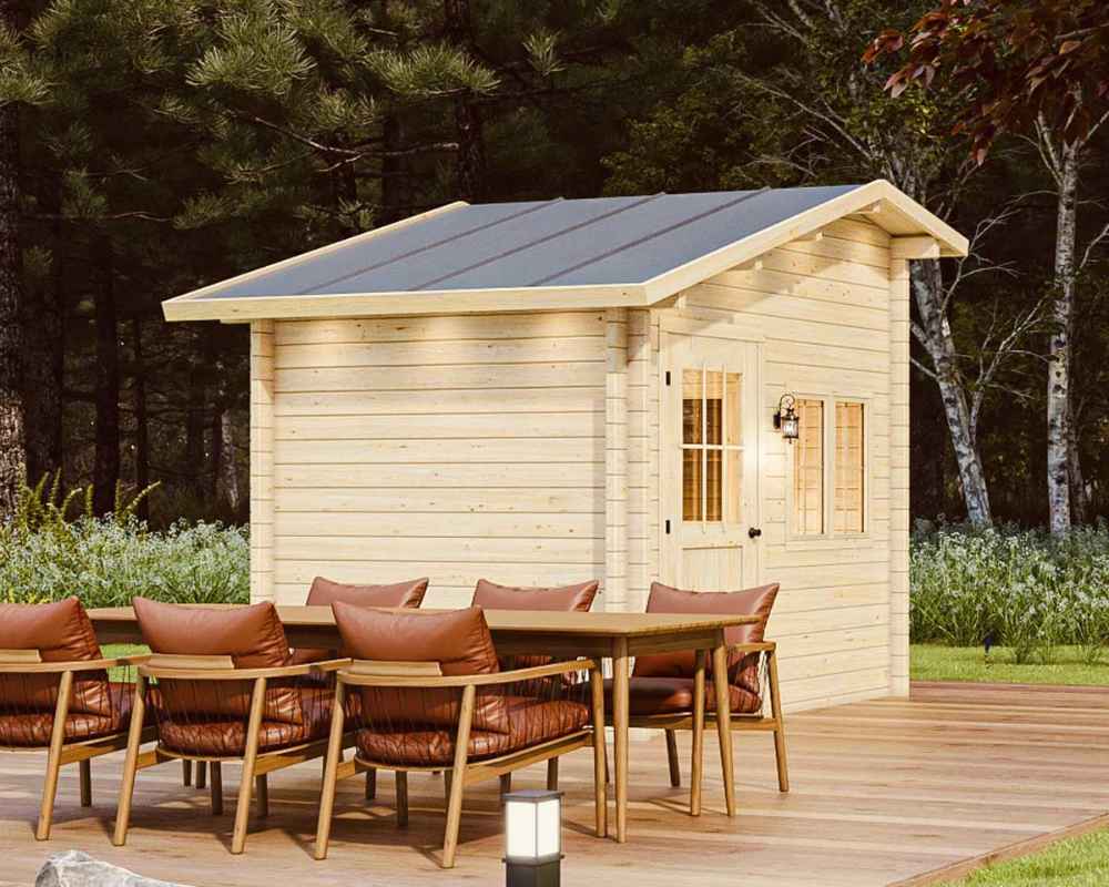 Back corner of the Sawmill Structures Bluewater Den 67 Garden Room, highlighting its clean wood finish and tall roof behind a dining table