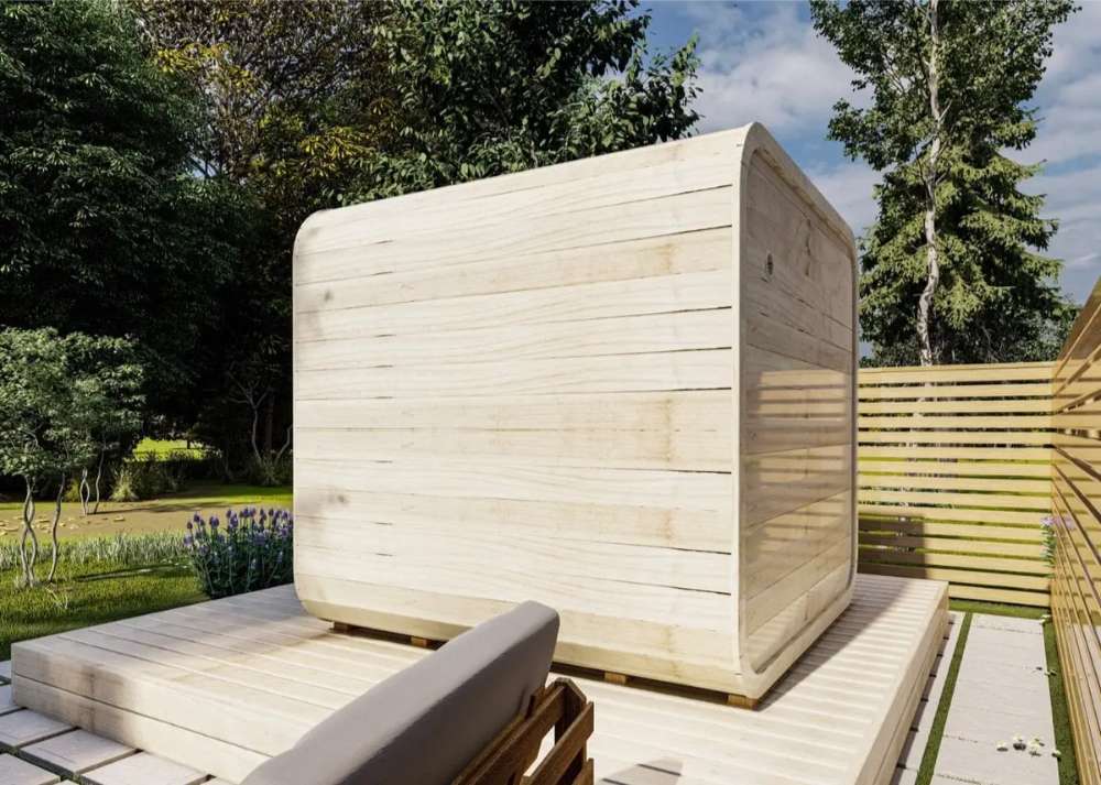 Back side of Sawmill Structures Box Sauna revealing its smooth, curved wooden exterior with no windows for privacy