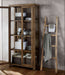 Bathroom storage setup featuring Crate & Barrel Morris 36" Chocolate Brown Wood and Glass Bookcase Cabinet with towels and baskets