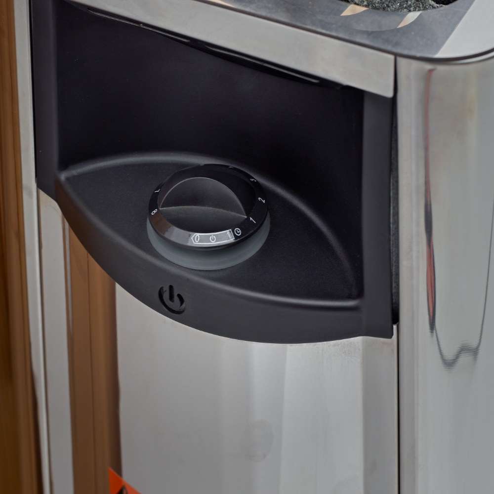 Black control dial on the front of the stainless steel Harvia stove in Golden Designs Arosa 4 Person Barrel Traditional Sauna