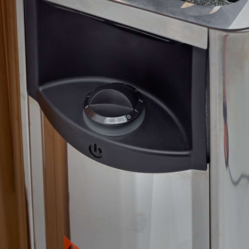 Black control dial on the front of the stainless steel Harvia stove in Golden Designs Copenhagen 3 Person Traditional Sauna