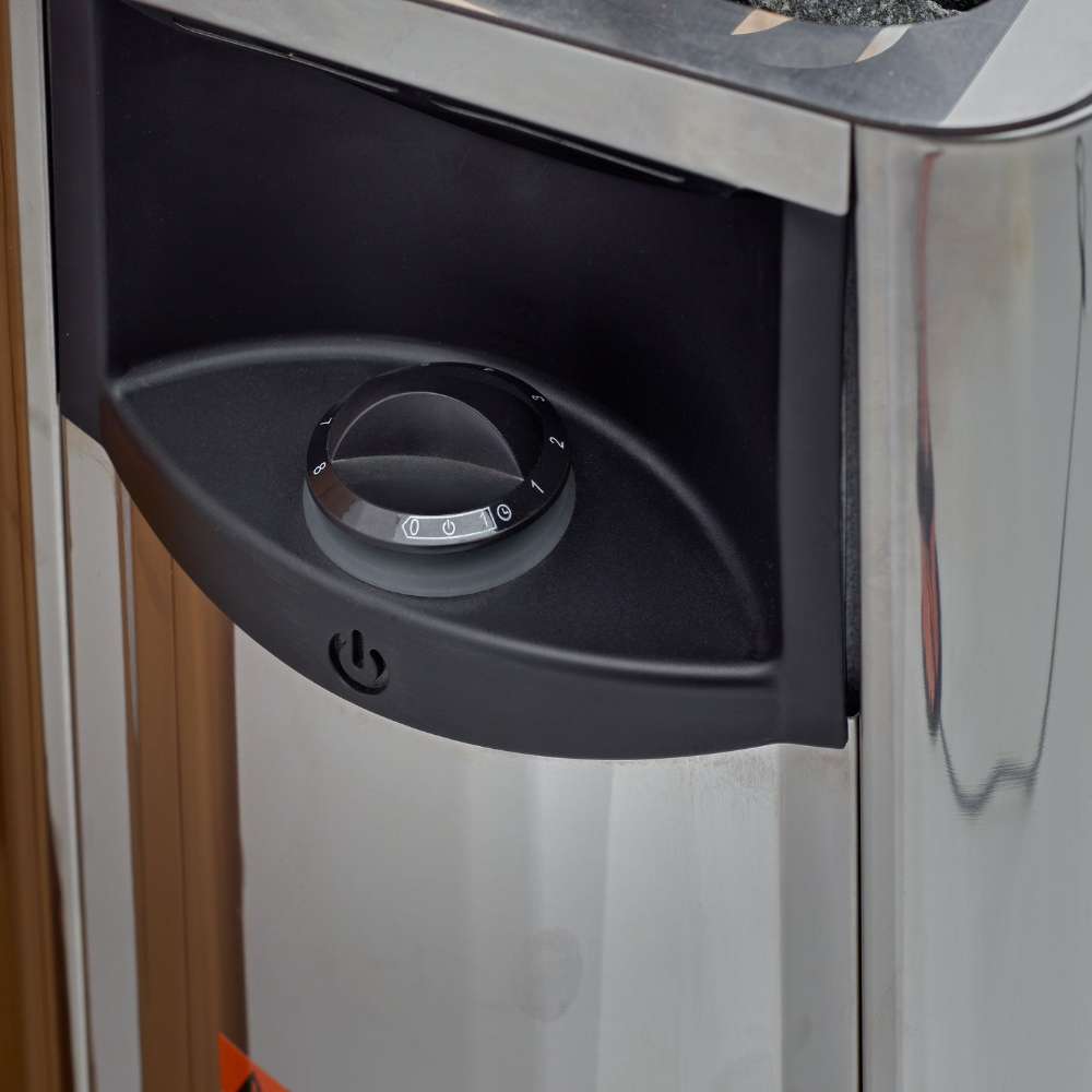 Black control dial on the front of the stainless steel stove in Golden Designs Osla 6 Person Traditional Sauna