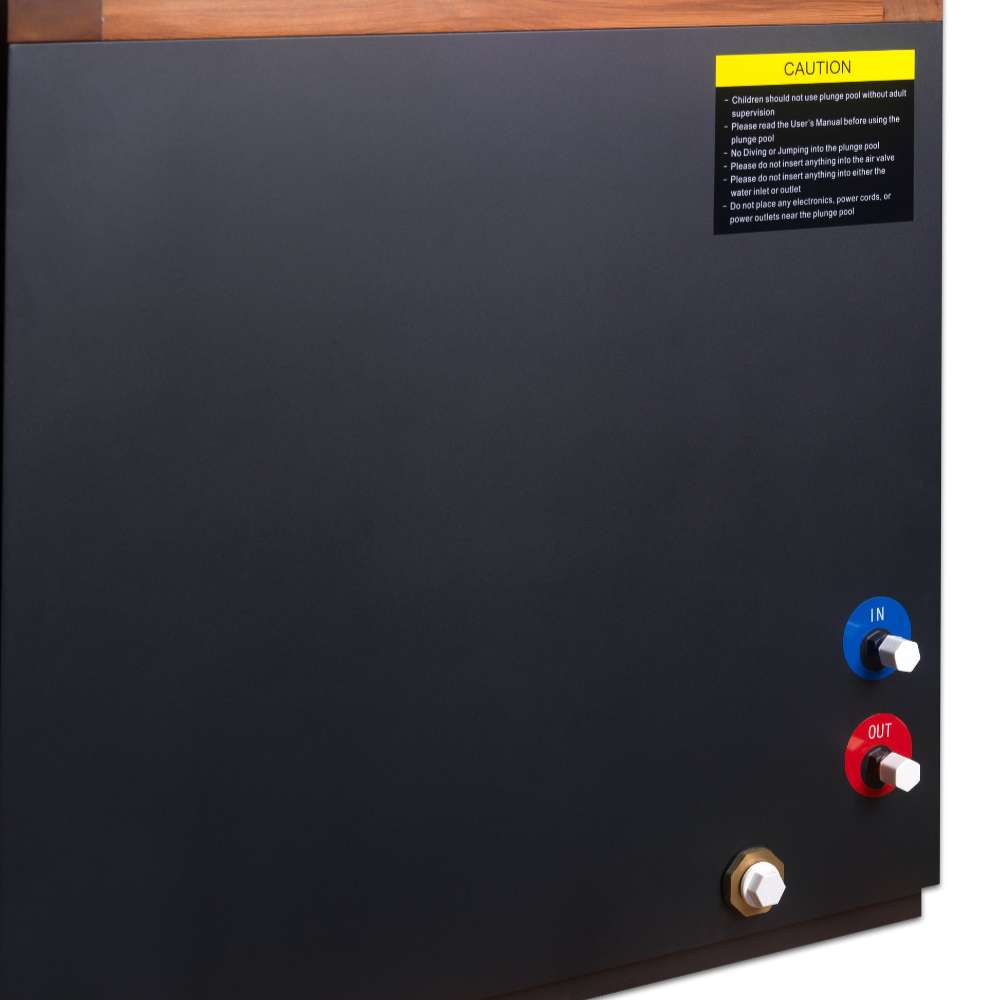 Blue and red water ports, a brass drain fitting and a yellow caution label appear on the dark side panel of Golden Designs Dynamic Cold Therapy Cuboid 304 Nano-Coated Stainless Steel Cold Plunge Tub