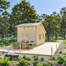 BlueWater Bungalow 160 with a spacious wooden deck, elegant outdoor dining furniture, pathway lights, and tall surrounding trees.