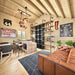 Cozy sports-bar interior in the BlueWater Bungalow 160 with leather seating, a bar counter, liquor shelving, television, and rustic decor.