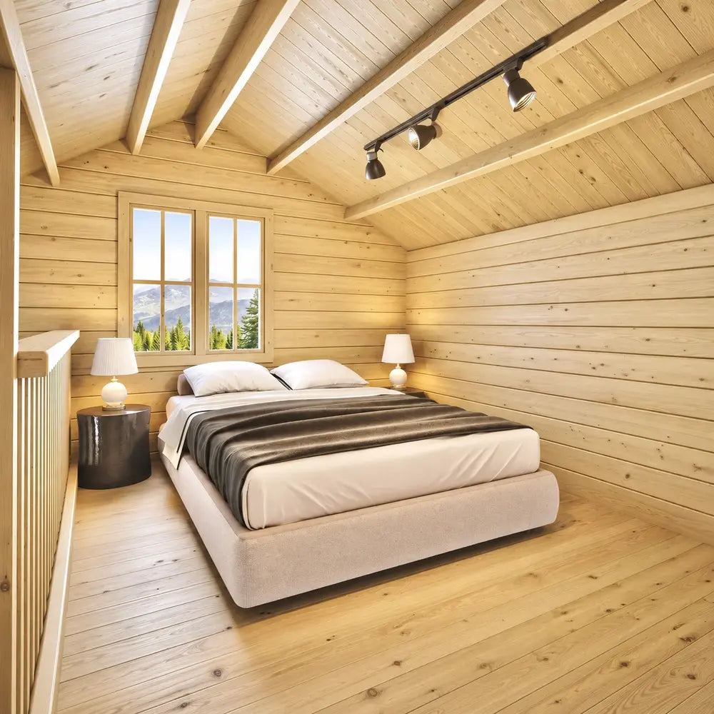 Peaceful BlueWater Loft 160 38mm bedroom with a double bed, two lamps, exposed rafters, and a mountain-view window.