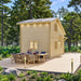 Side view of the BlueWater Loft 160 38mm showing its modern roofline, tall windows, and long outdoor dining table.