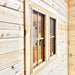 Angled exterior close-up of two screened Bluewater Den 67 windows with detailed wooden framing and a visible black handle.