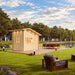 Bluewater Den 67 beside a pond with an outdoor dining table, pathway lights and cushioned lounge seating in the foreground.