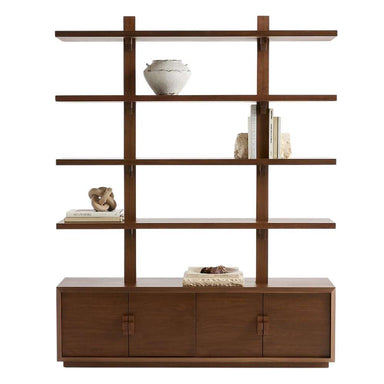 Books, pottery, and decorative accessories style Crate & Barrel Steppe 68" Walnut Storage Bookcase Room Divider, showing its open shelving and enclosed cabinet storage