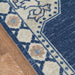 Border of Momeni Anatolia Indoor Rug - ANA-3 Navy features decorative motifs in blue, ivory, and beige