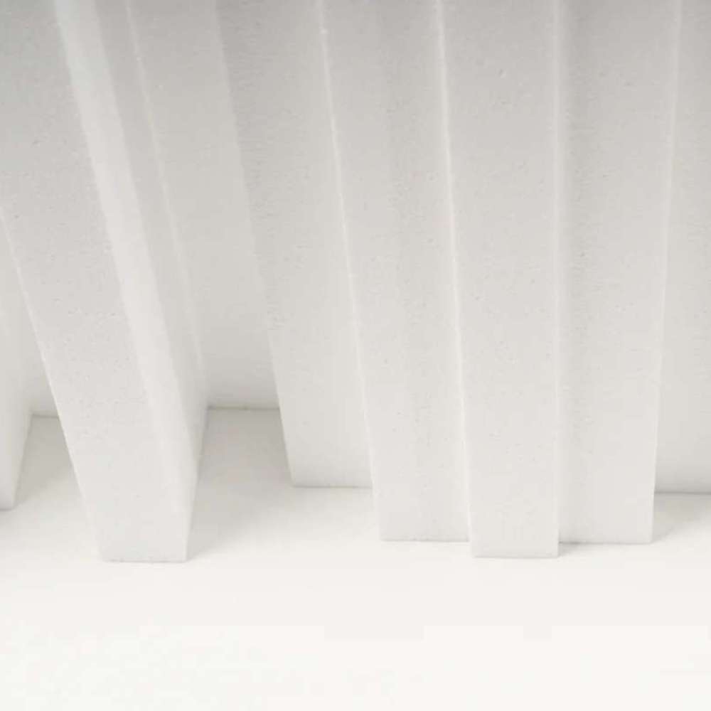 Bottom view of a white GIK Acoustics GridFusor™ Diffuser with multiple vertical fins arranged to disperse sound reflections