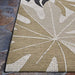 Bottom corner of Couristan Dolce Indoor/Outdoor Rug - Aralia/Naturals-Cool Onyx displays leaf-like designs spreading from a central point in neutral hues