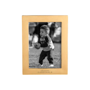 Brass Arizona Cardinals Crate & Barrel NFL Signature Tabletop Picture Frame featuring a warm metallic finish and a black-and-white photo of a child holding a football