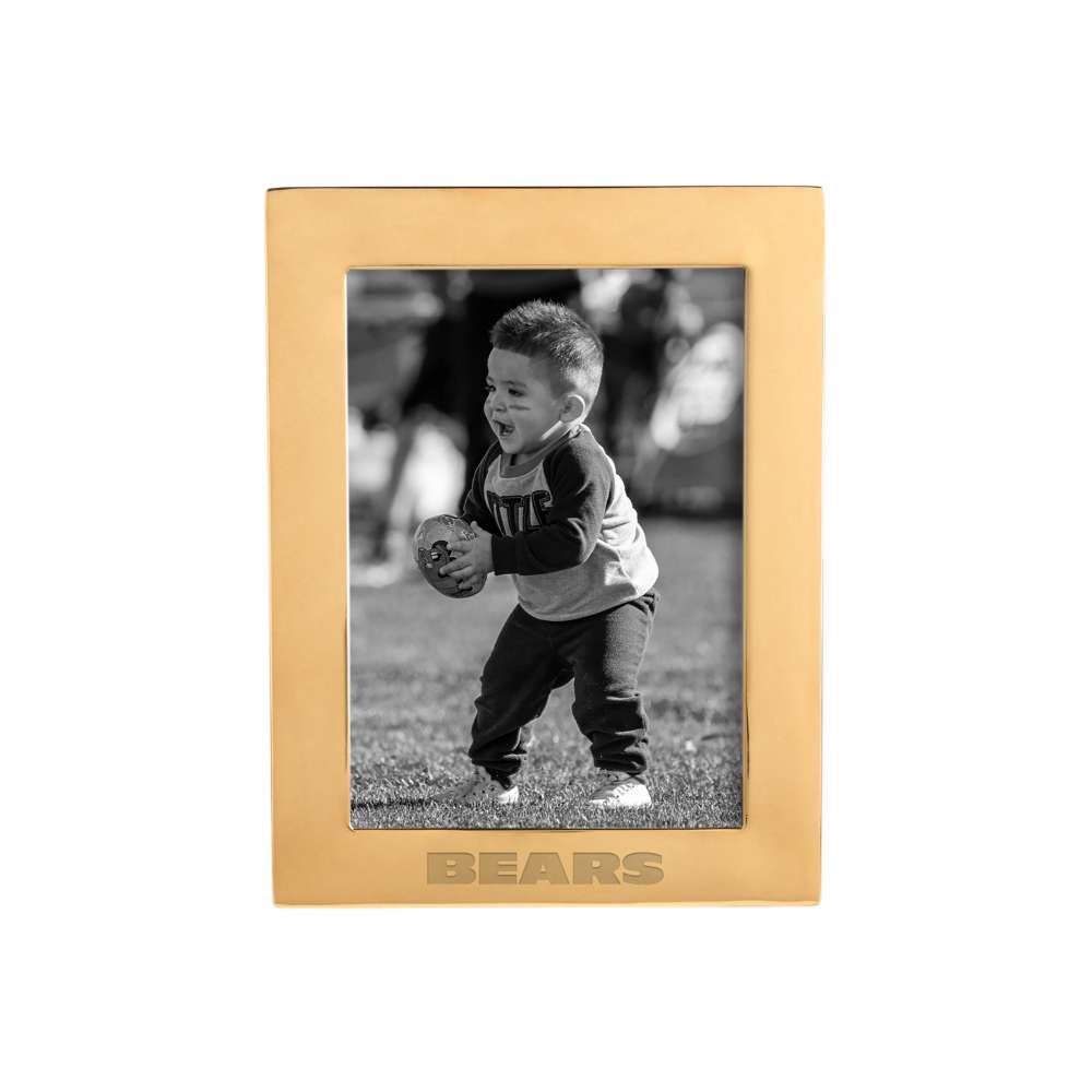 Brass Chicago Bears Crate & Barrel NFL Signature Tabletop Picture Frame featuring a wide brass finish and an inset black-and-white photo of a child holding a small football