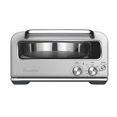 Breville® Smart Oven® Pizzaiolo Pizza Oven front view shows the empty pizza stone and manual control dials