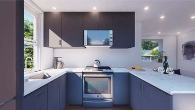 Bright kitchen in Sawmill Structures The Muskoka Garden Suites features dark cabinetry, white countertops, and a full appliance suite in a U-shaped layout