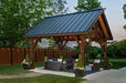 Brookside Timber Frame Alpine Lodge Pavilion stands elegantly in a backyard