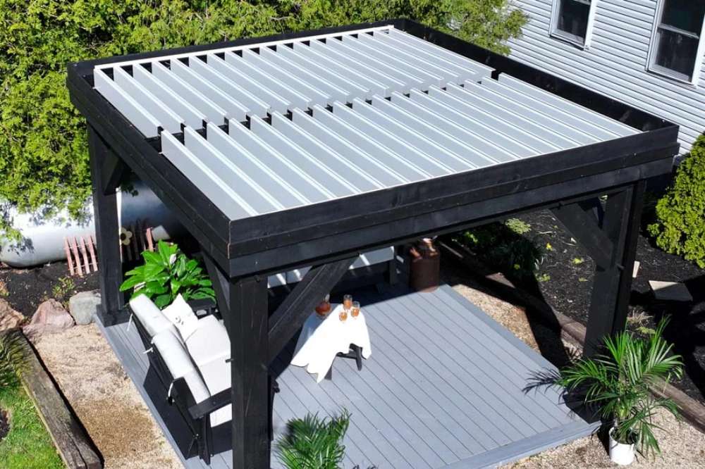 Brookside Timber Frame Zion Resort Pergola features a sleek black timber frame with a modern louvered roof